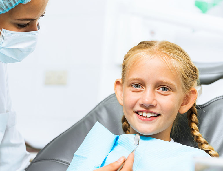 Close-up of a smile showing even teeth after dental bonding