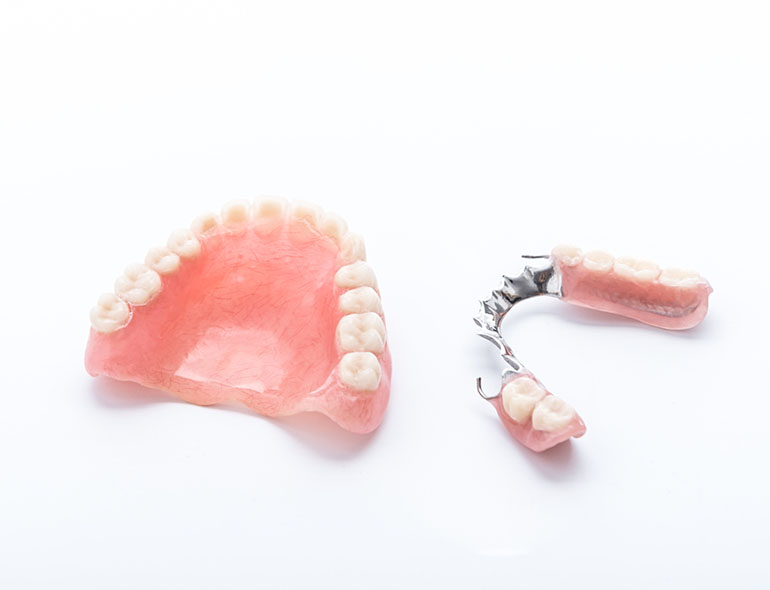 Full and partial dentures for restoring missing teeth and confident smiles